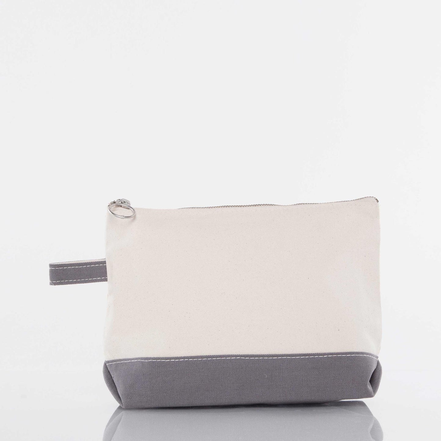 Natural canvas pouch with gray bottom band and matching side loop; top zipper with round metal pull.