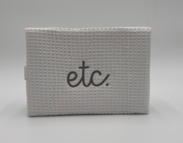 "Etc." Large Waffle Cosmetic Bag-White with silver stitching