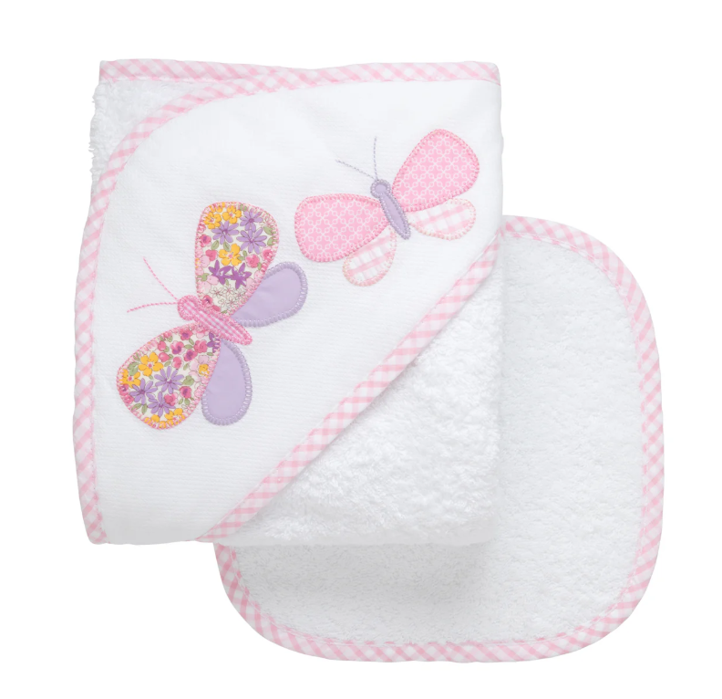 White hooded baby towel with butterfly appliqué; matching washcloth shown.