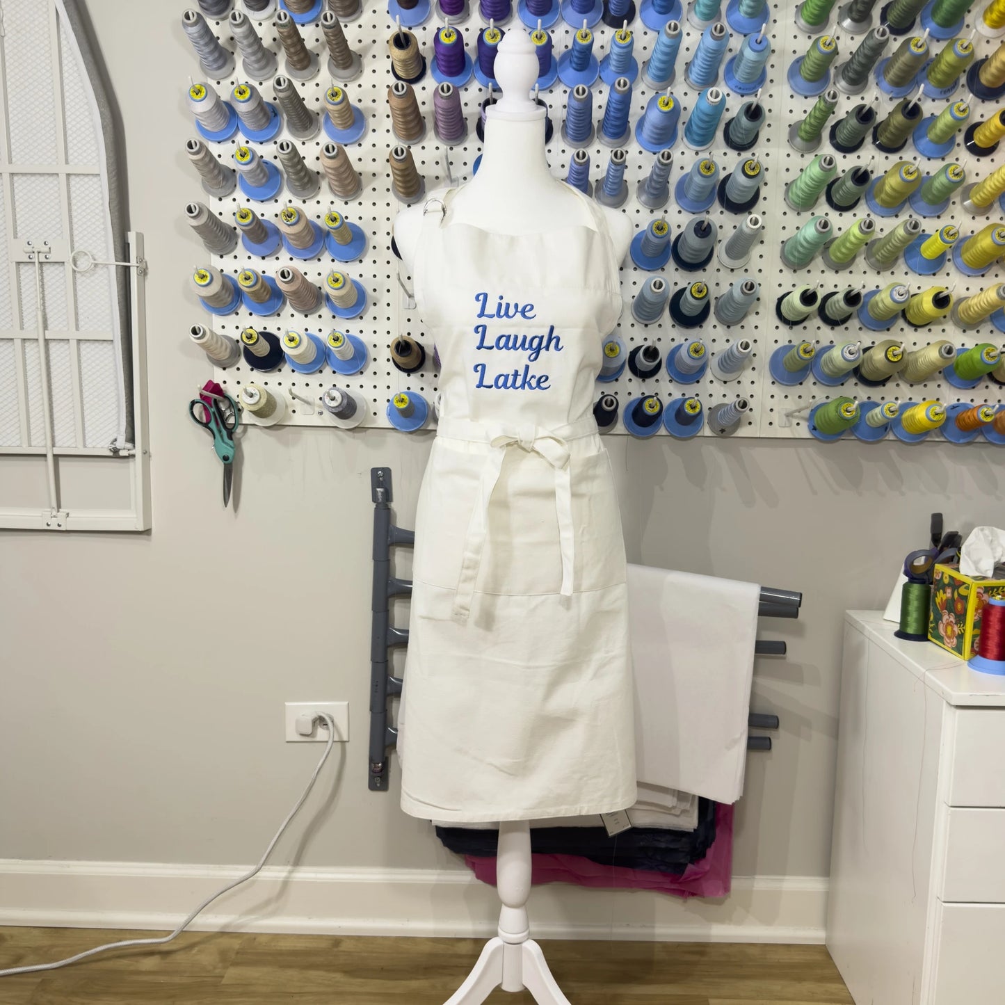 "Live Laugh Latke" Embroidered Denim Apron - White with Blue Embroidery