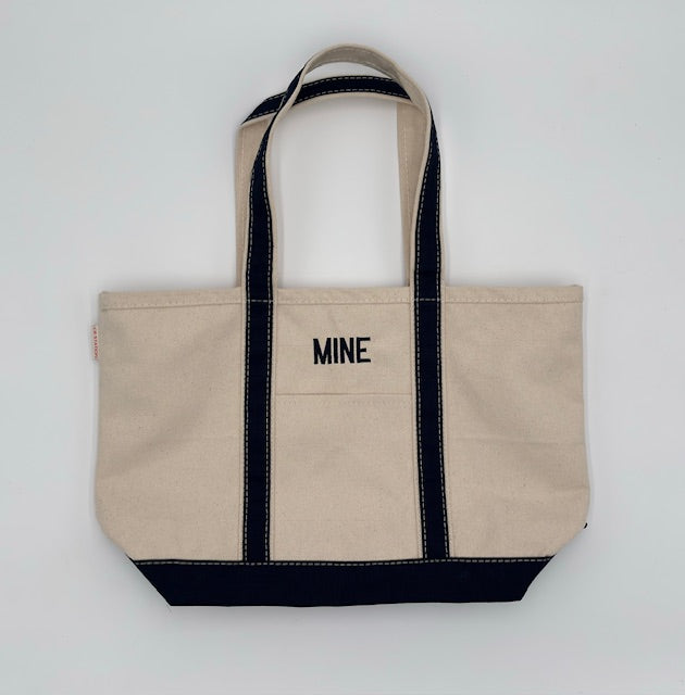 Natural and navy blue canvas boat tote embroidered ‘MINE’ in navy blue