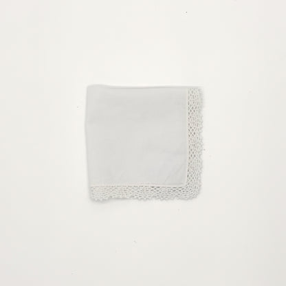 White cotton handkerchief with crochet lace edging, 12" x 12", folded into a square against a white background.