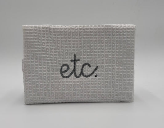 "Etc." Large Waffle Cosmetic Bag-White with silver stitching