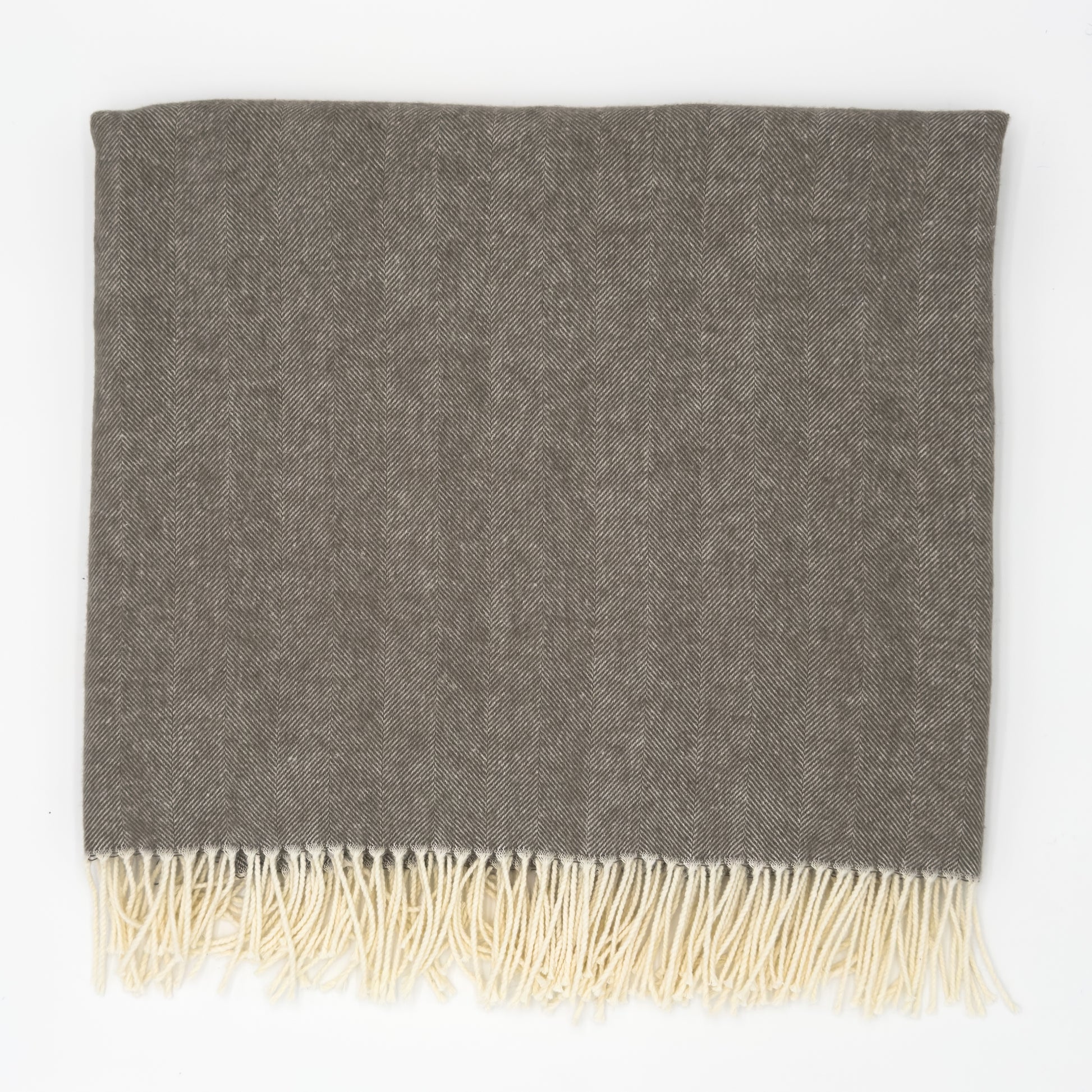 Mink brown herringbone throw with ivory fringe, soft woven texture, folded. Add custom embroidery along the bottom-center of the blanket.
